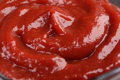 Organic ketchup as background, closeup. Tomato sauce