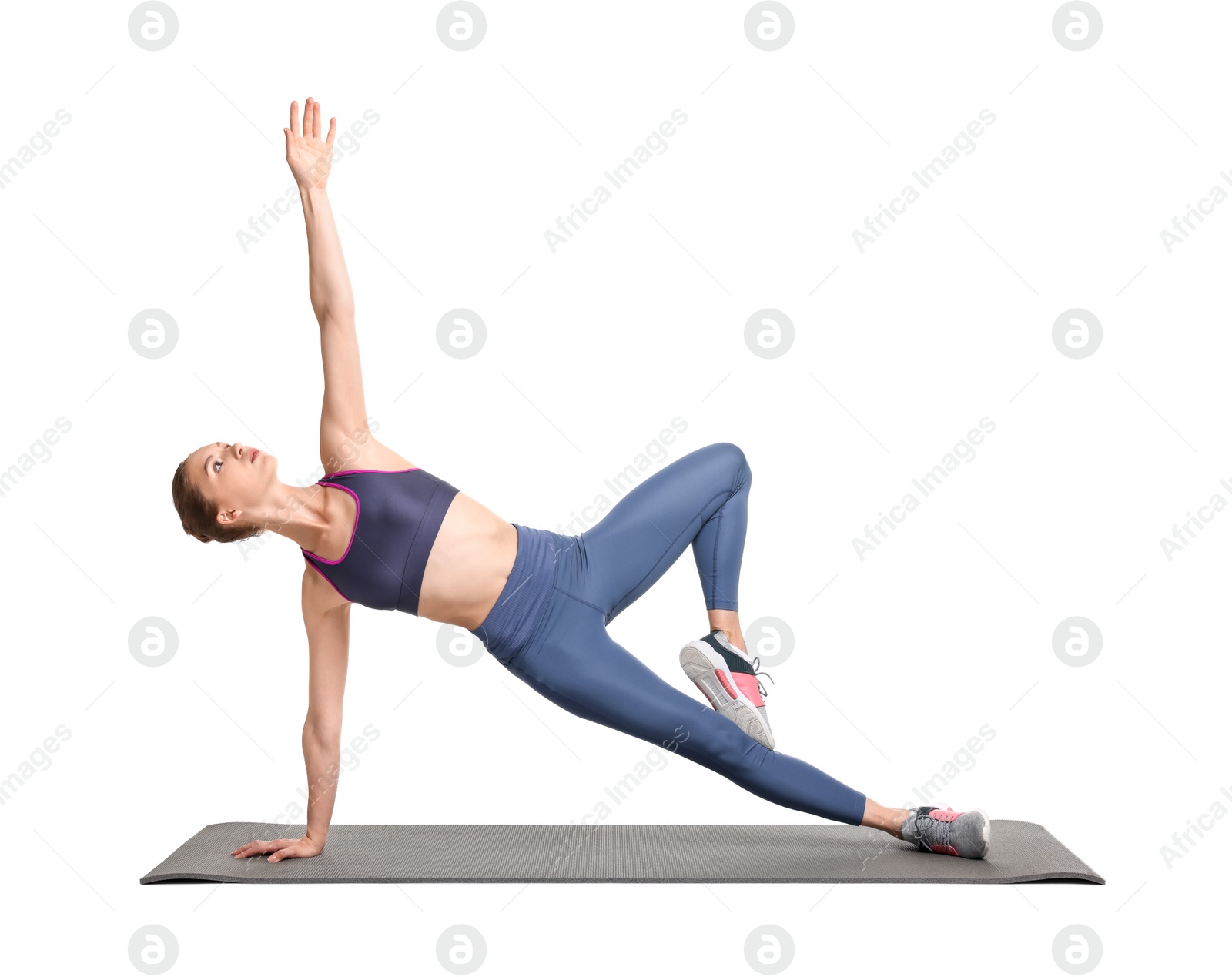 Photo of Young woman practicing yoga on white background