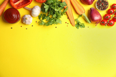 Photo of Flat lay composition with ingredients for cooking on yellow background. Space for text