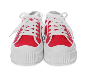 Photo of Pair of red classic old school sneakers on white background