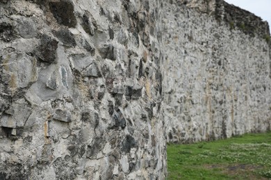 Photo of Grey stone wall of old building outdoors