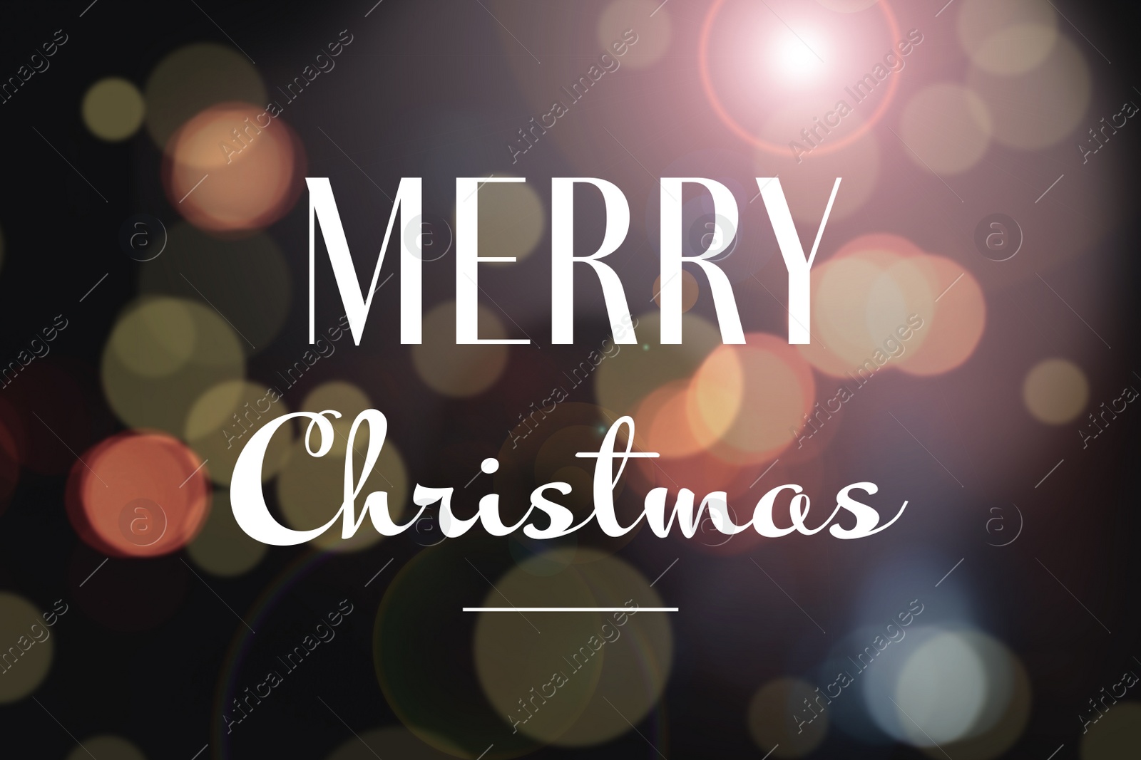 Image of Blurred view of beautiful lights and phrase Merry Christmas. Holiday greeting card design 