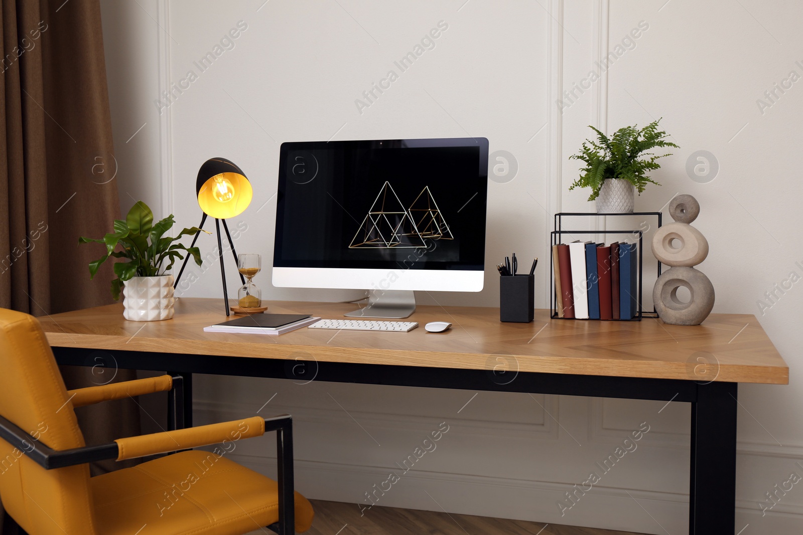 Photo of Room interior with comfortable workplace. Modern computer on wooden desk