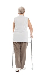 Elderly woman using walking frame isolated on white, back view