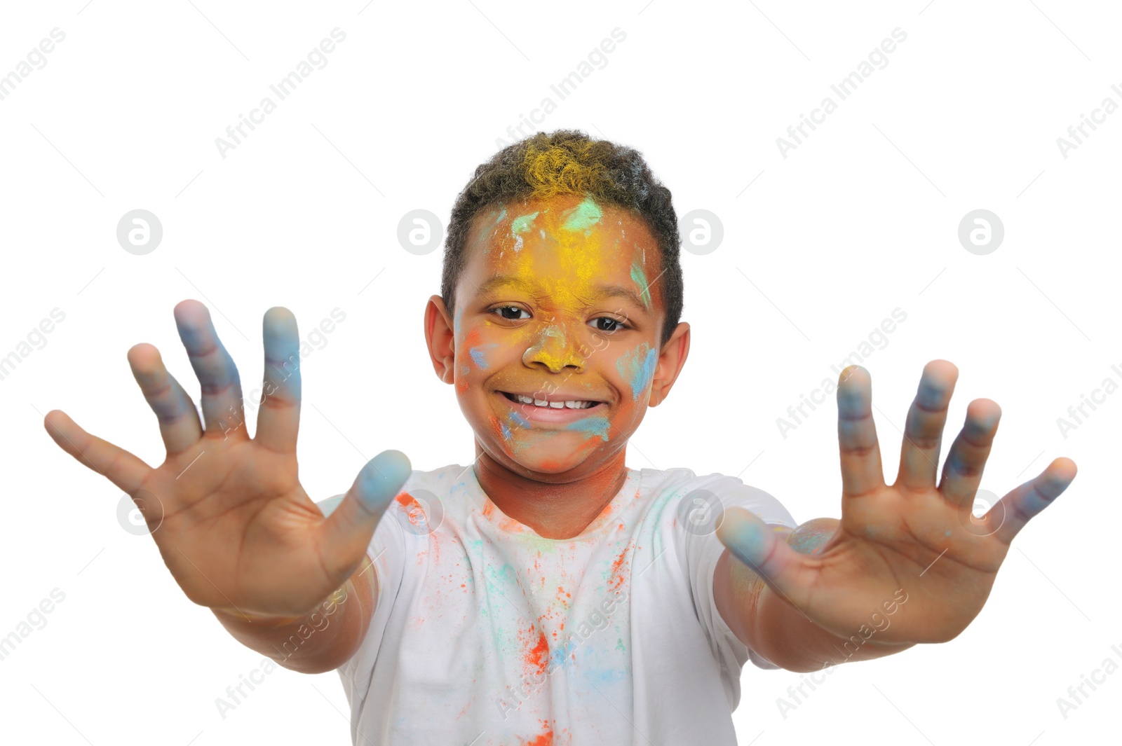 Photo of African American boy covered with colorful powder dyes on white background. Holi festival celebration