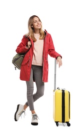 Photo of Woman with suitcase on white background. Winter travel