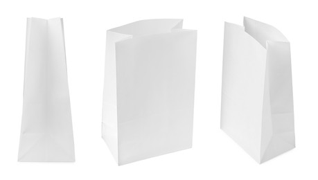 Image of Set with paper bags on white background 