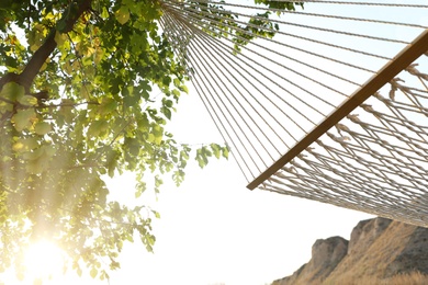 Empty hammock hanging outdoors. Time to relax