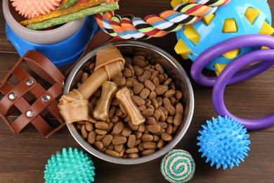 Different pet goods on wooden table, above view. Shop assortment