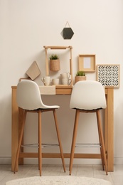 Modern room interior with wooden dining table