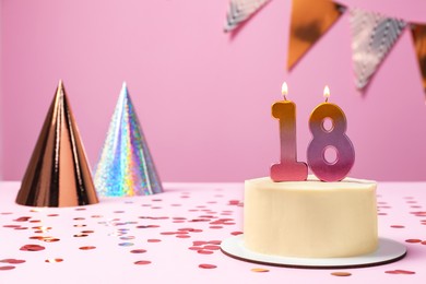 Photo of 18th birthday. Delicious cake with number shaped candles for coming of age party on table against lilac background, space for text