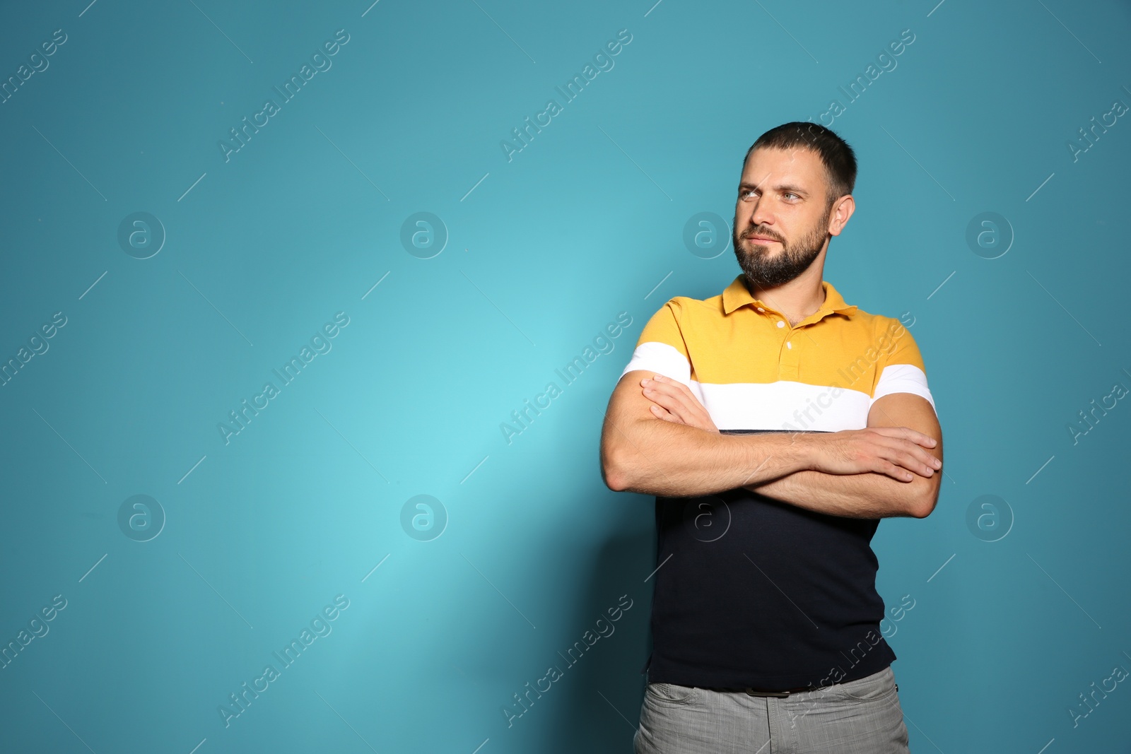 Photo of Portrait of man in casual clothes on color background