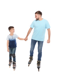 Father and son with roller skates on white background