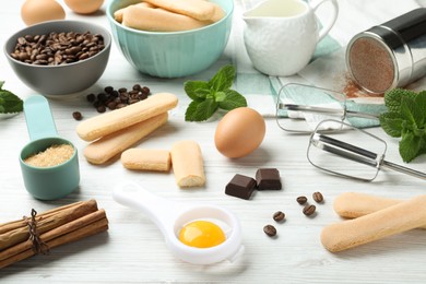 Photo of Composition with ingredients for tiramisu on white wooden table