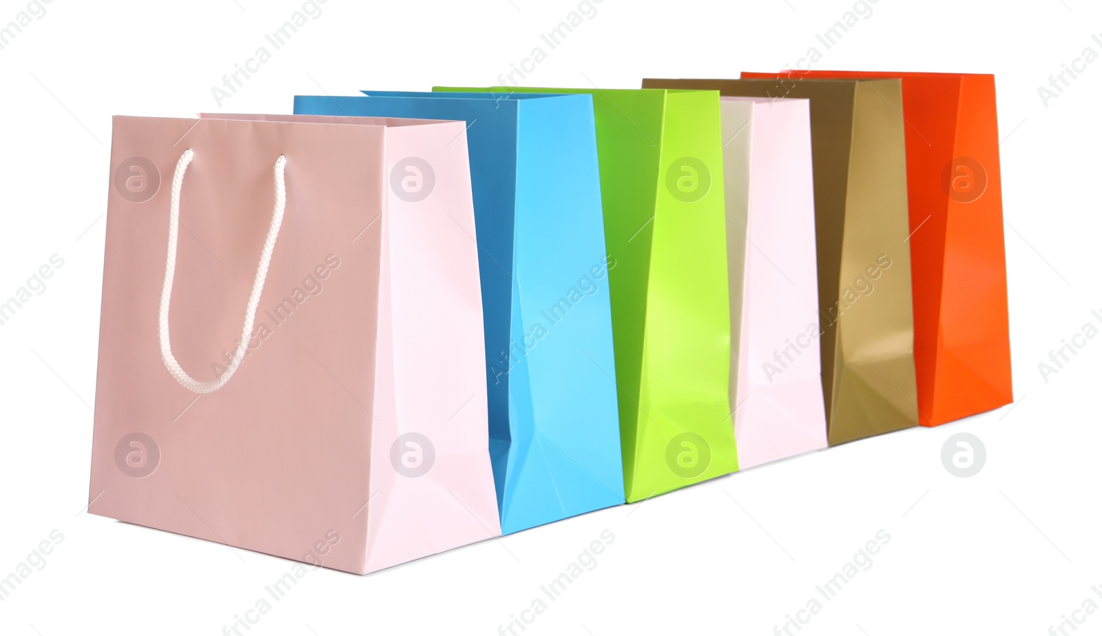 Photo of Colorful paper shopping bags isolated on white