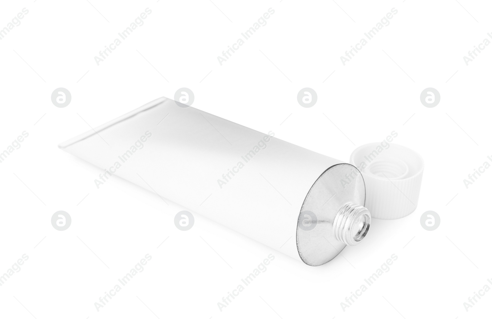 Photo of Open tube of ointment isolated on white