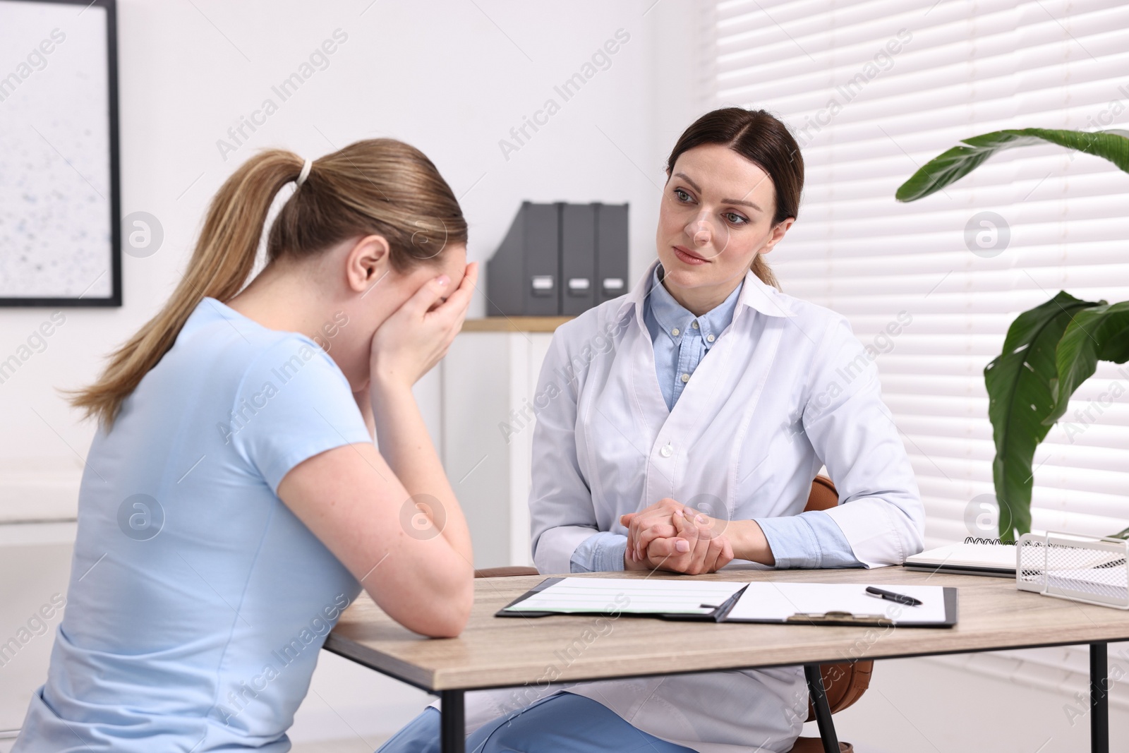 Photo of Mammologist's appointment. Doctor and woman in hospital