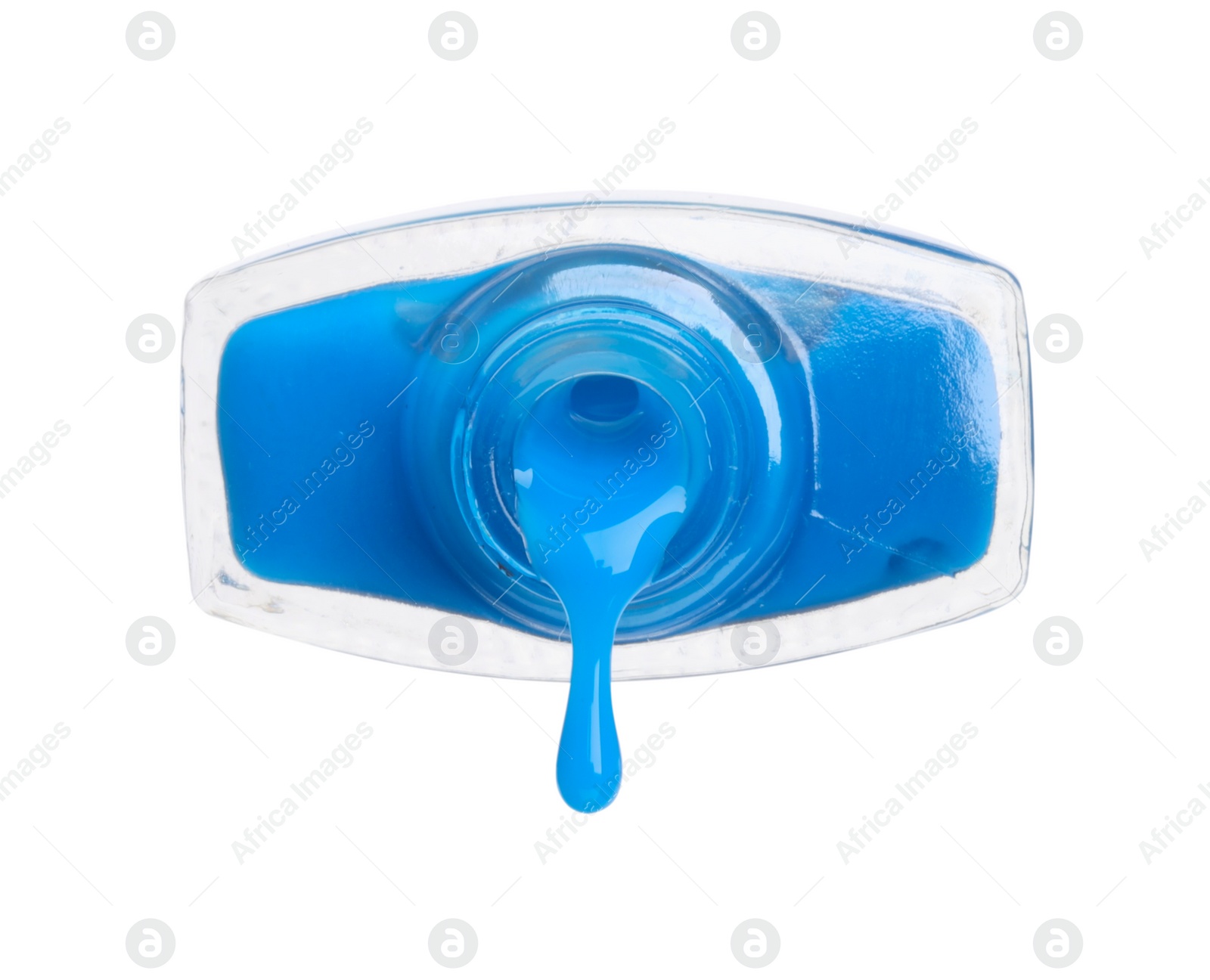 Photo of Blue nail polish dripping from bottle isolated on white