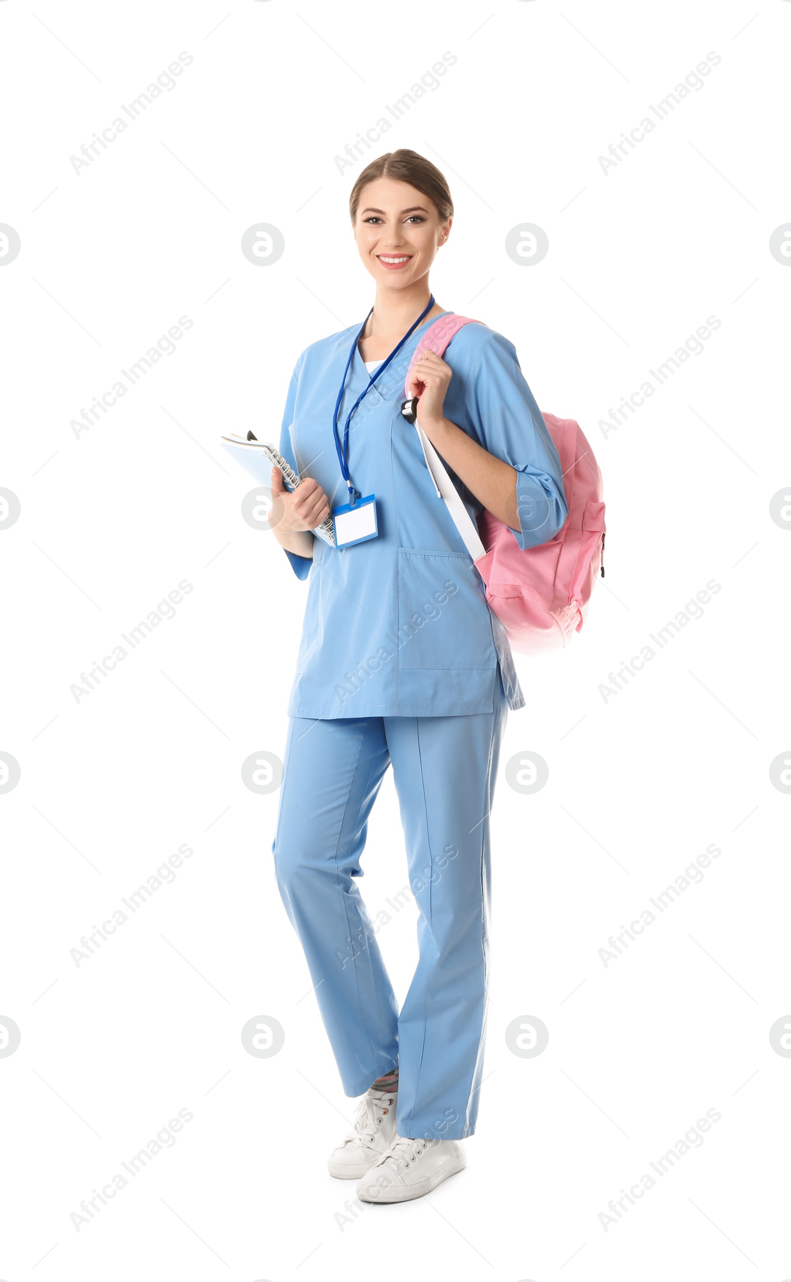 Photo of Young medical student with notebooks and backpack on white background