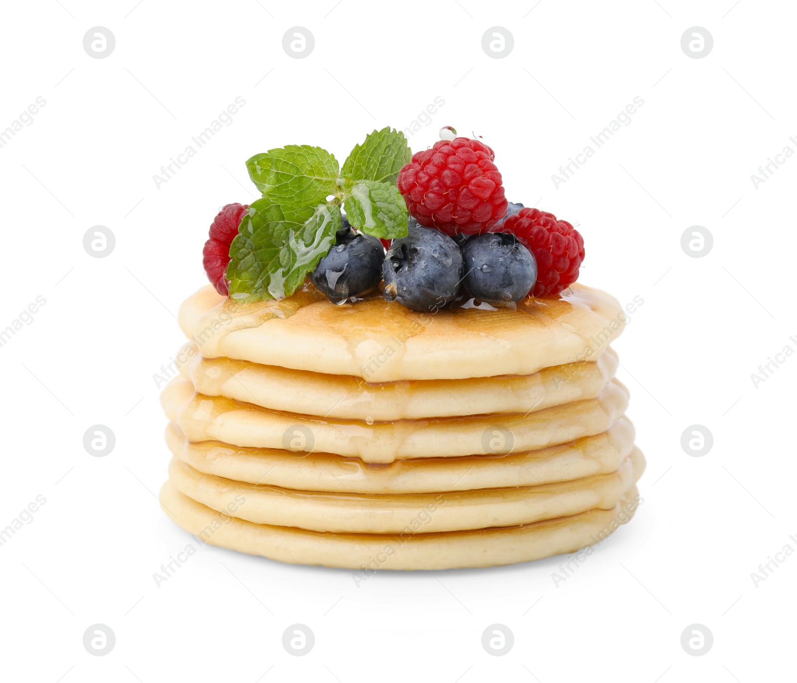 Photo of Delicious pancakes with berries, honey and mint isolated on white