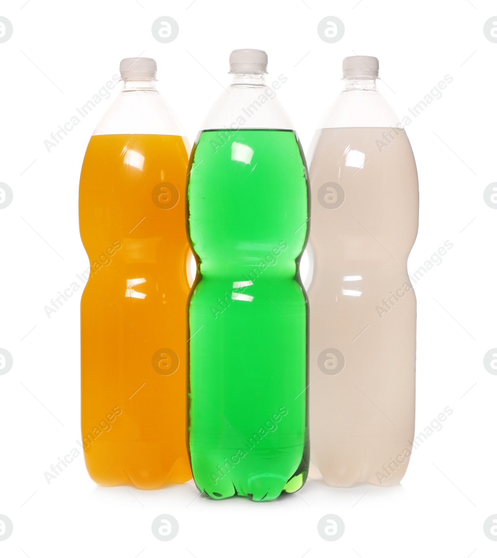 Photo of Bottles of soft drinks on white background