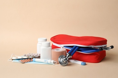 Photo of First aid kit on color background. Health care