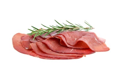 Photo of Slices of tasty bresaola and rosemary isolated on white