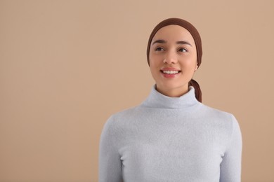 Smiling woman with cancer on beige background. Space for text