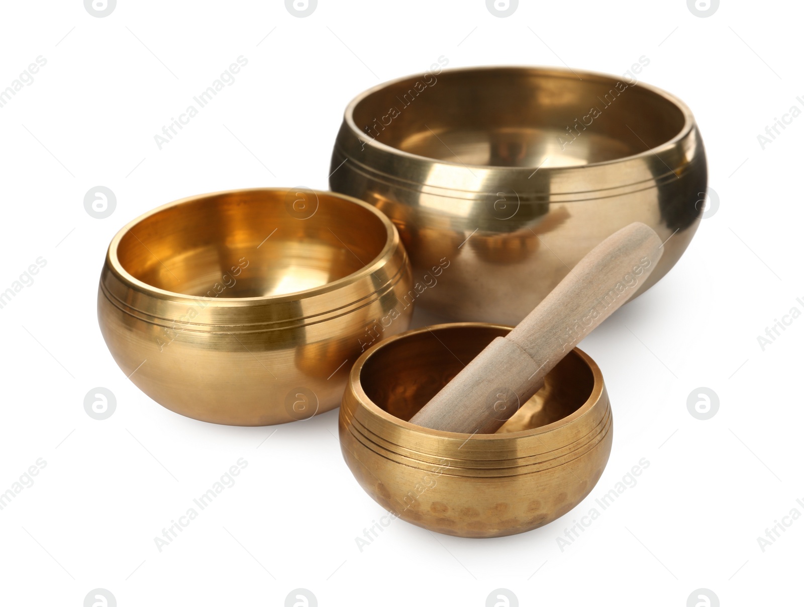Photo of Tibetan singing bowls and wooden mallet on white background
