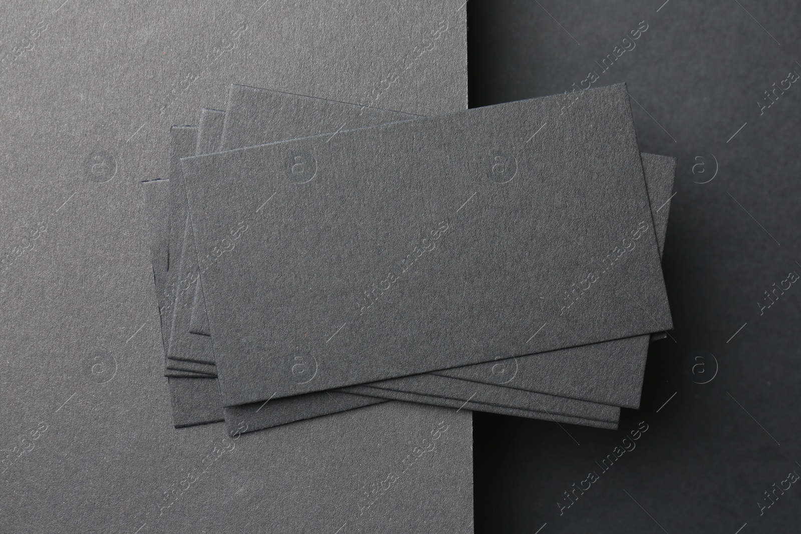 Photo of Blank business cards on black background, top view. Mockup for design