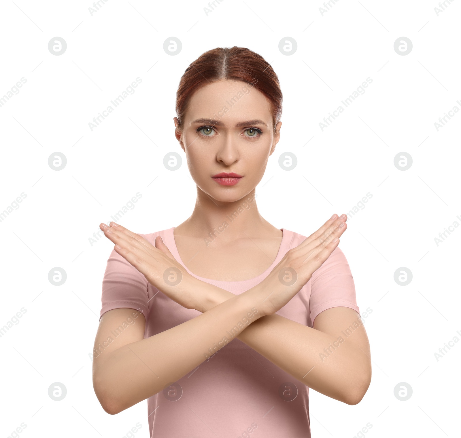 Photo of Stop gesture. Woman with crossed hands on white background