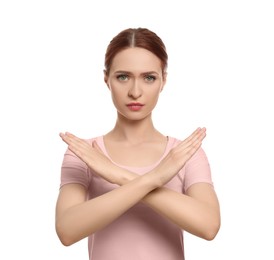 Photo of Stop gesture. Woman with crossed hands on white background