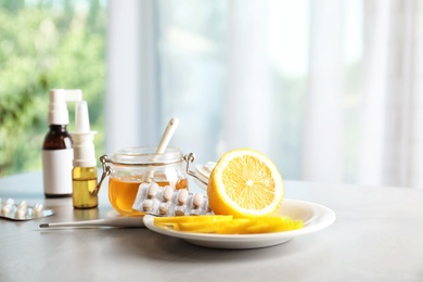 Photo of Natural and medical cold remedies on table