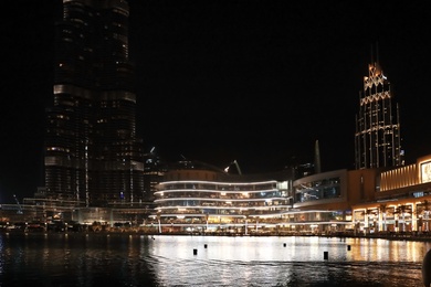 Photo of DUBAI, UNITED ARAB EMIRATES - NOVEMBER 04, 2018: Night cityscape with illuminated buildings