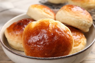 Tasty scones prepared on soda water on wooden table, closeup