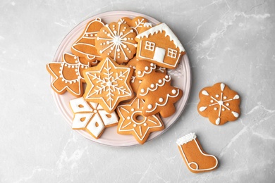 Photo of Plate with tasty homemade Christmas cookies on table, top view