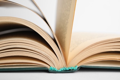 Closeup view of open book on white background