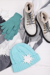 Photo of Winter fashion. Layout of women's outfit on white wooden background, top view