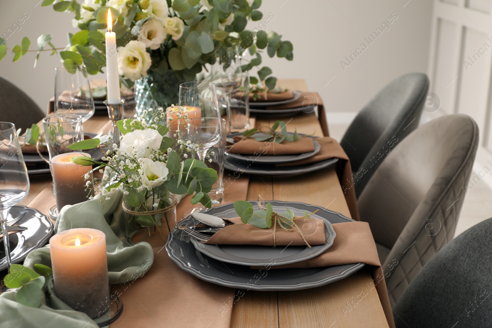 Photo of Festive table setting with beautiful floral decor indoors