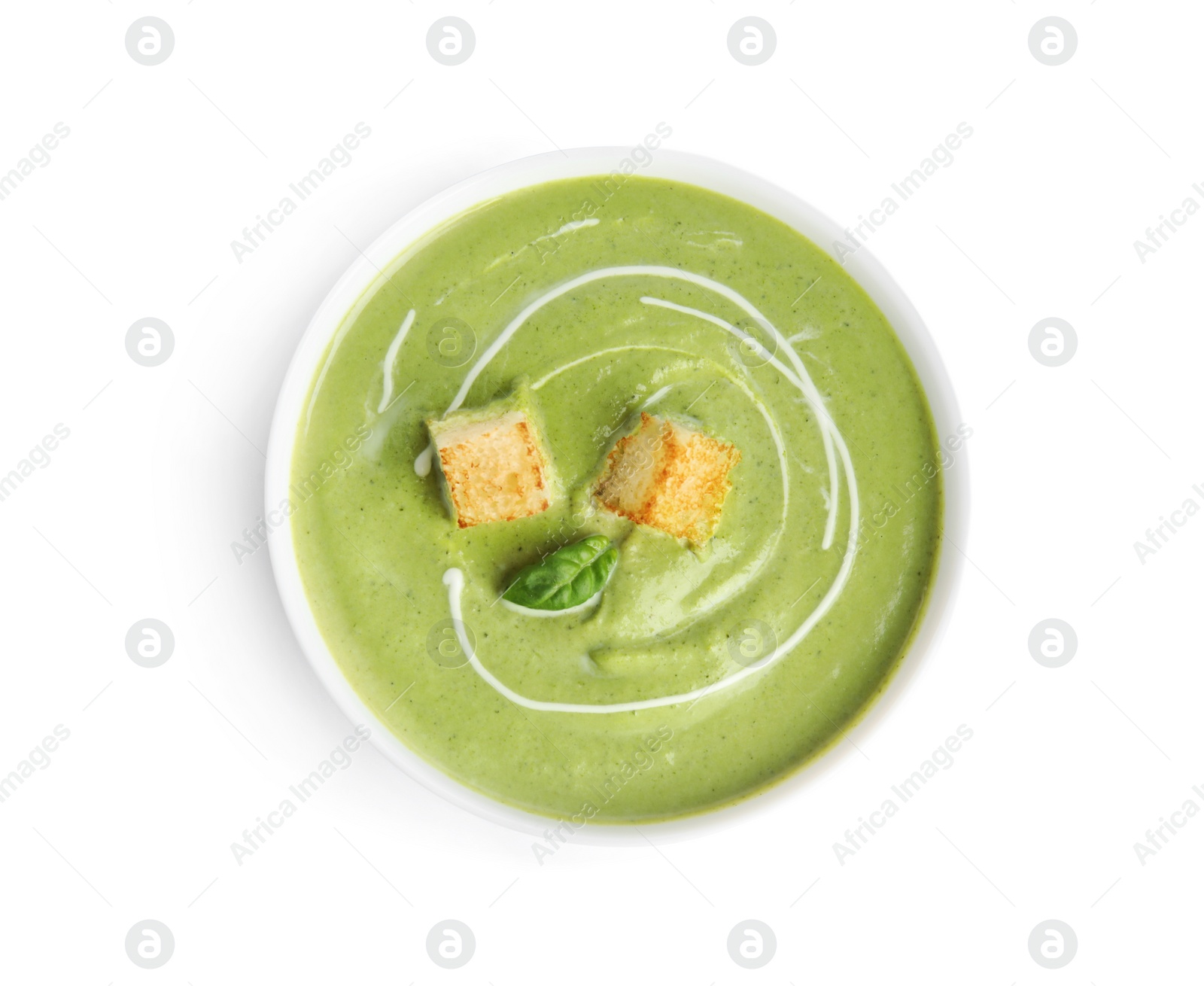 Photo of Delicious broccoli cream soup with croutons isolated on white, top view