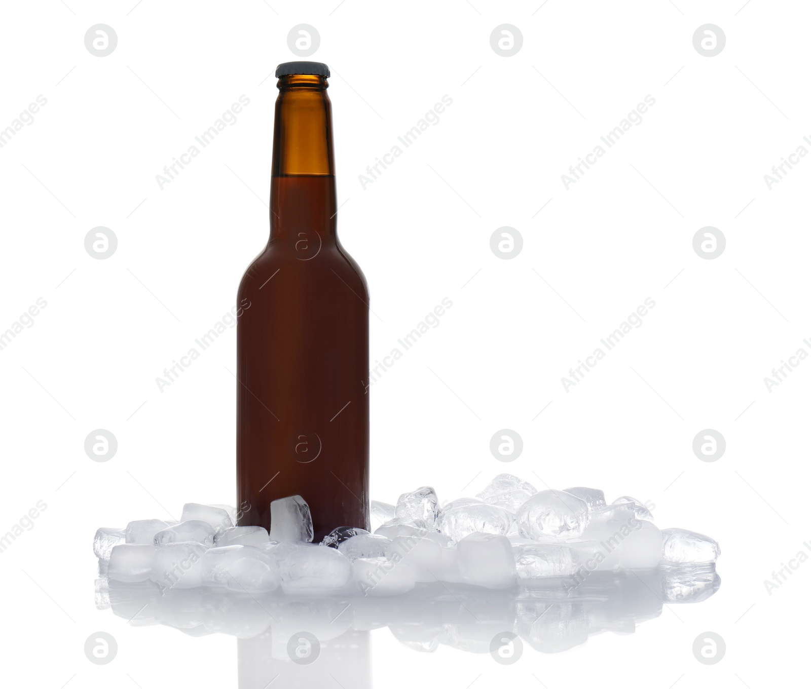 Photo of Bottle of beer and ice cubes on white background