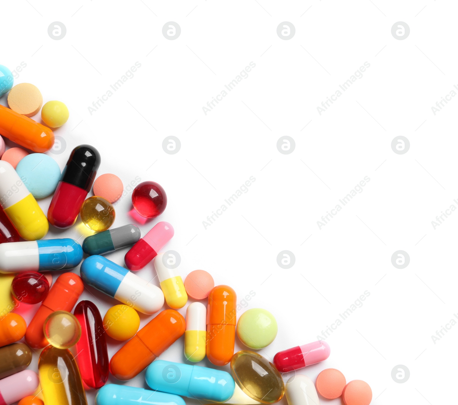 Photo of Lots of different colorful pills isolated on white, top view