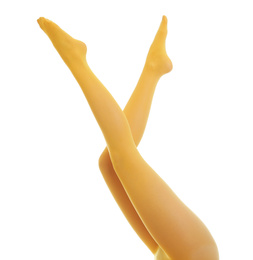 Woman wearing yellow tights on white background, closeup of legs