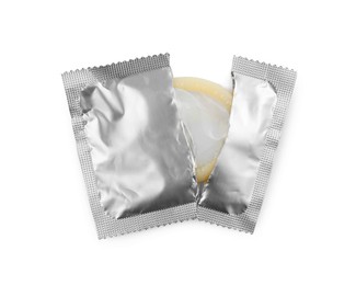 Photo of Torn package with condom isolated on white, top view. Safe sex