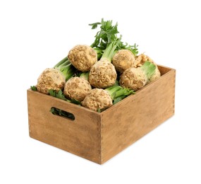 Photo of Wooden crate with fresh raw celery roots isolated on white