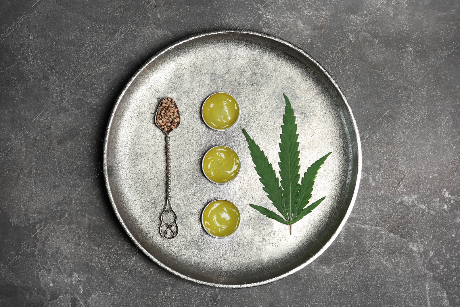 Photo of Flat lay composition with hemp lotion on grey background