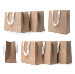 Image of Set with kraft paper shopping bags on white background