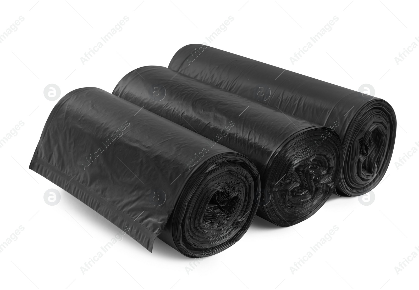 Photo of Rolls of different garbage bags on white background. Cleaning supplies