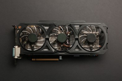 Photo of One graphics card on black background, top view