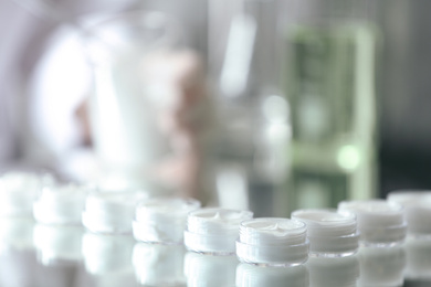 Small jars with cream in cosmetic laboratory